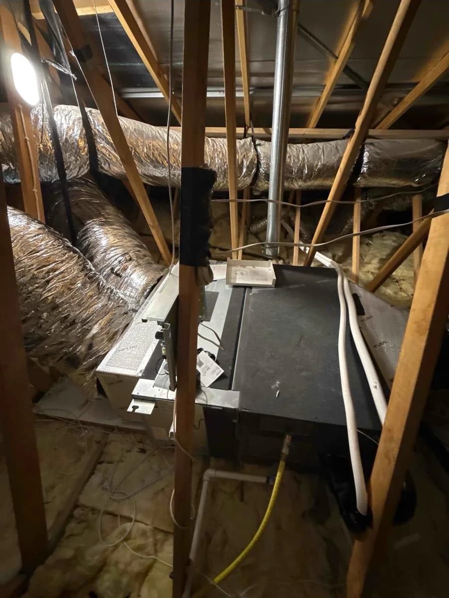 Whole-home ducted air-conditioning indoor unit installed within a roof space